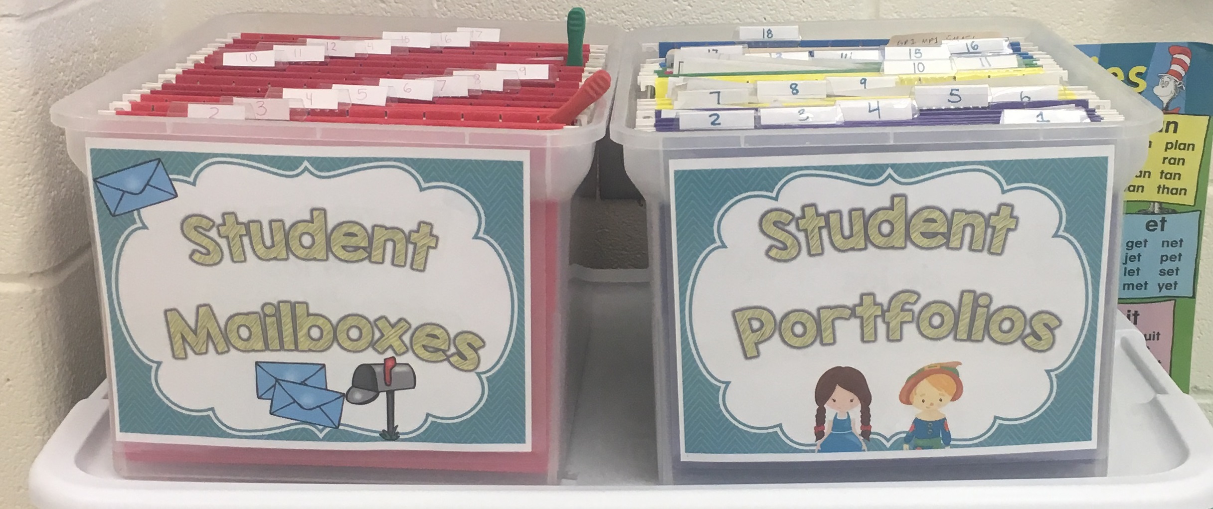One bin with hanging folders for student portfolios. One bin with hanging folders with student mailboxes.