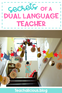 Going upstairs in a school with decorations on the ceiling with text" Secrets of a dual language teacher"